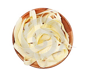 Plate with sliced fresh parsnip on white background, top view