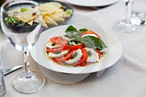 Plate of slices of mozzarella cheese and tomatoes