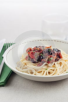 Plate of spaghetti a la putanesca photo