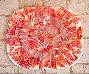 Plate of Spanish jamon iberico sliced