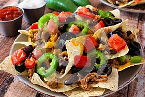 Plate of spicy fully loaded Mexican nachos