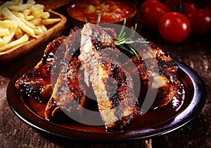 Plate of spicy marinated grilled spare ribs photo