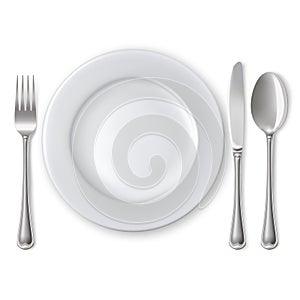 Plate with spoon, knife and fork photo