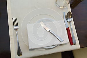 Plate, spoon, knife and fork table arrangement