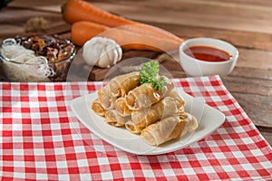 Plate of spring rolls on the table in restaurant