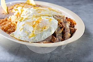 plate of steak ranchero and eggs