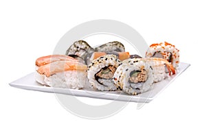 Plate with sushi on white background