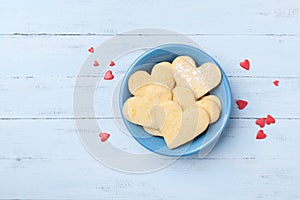 Plate with sweet baking for Valentines day. Shortbread cookies in shape of heart top view.