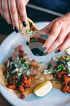 A plate of tacos and tortilla