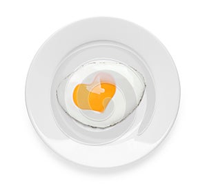 Plate with tasty fried egg with yolk in shape of heart on white background, top view