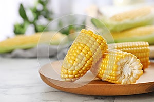 Plate with tasty sweet corn cob