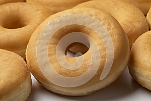 Plate with of tasty sweet traditional donuts close up