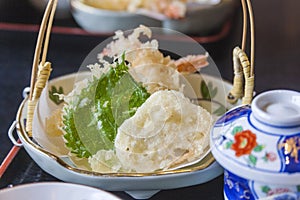 A plate with tempura, shiso leaf in a japanese restaurant