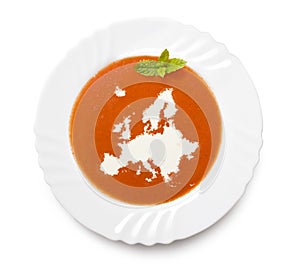 Plate tomato soup with cream in the shape of Europ