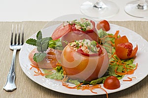Plate with tomatoes stuffed with rice. photo