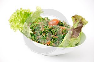 Plate of traditional Arabic salad tabbouleh.