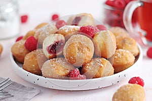 A plate with traditional berliner cakes with jelly