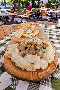 Plate of traditional Slovak dishes - kapustove strapacky & x28;dumplings with cabbage& x29;, bryndzove pirohy