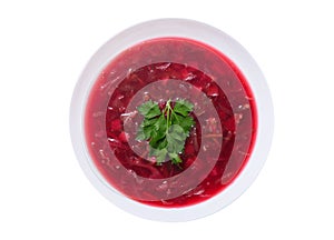 Plate of traditional Ukrainian or Russian soup borscht isolated on white background