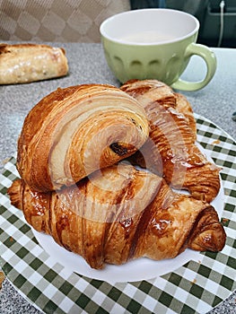 Plate of typical French pastries: croissants and pain au chocolat