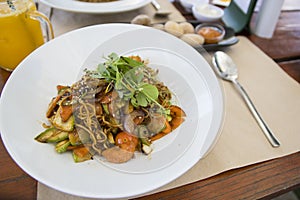 Plate with vegan asian food. Wok noodles with vegetables