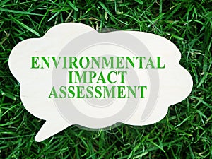 Plate with words Environmental impact assessment EIA. photo