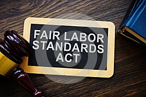 Plate with words Fair labor standards act FLSA and gavel.