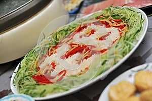 Plate of Yu Sheng (raw fish salad) photo