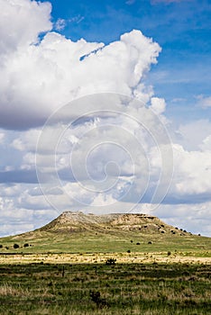 Plateau in Field with Cloudscape