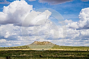 Plateau in Field with Cloudscape