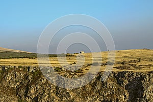 Plateau about mount Aragats with yellowed fields and orchards above the Kasakh river canyon near Ashtarak city