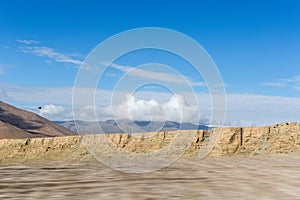 Plateau wilderness with dirt road motion blur