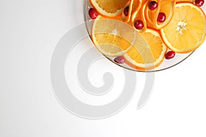 Plated cranberries and juicy orange slices