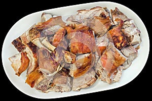 Plateful Of Gourmet Delicious Freshly Spit Roasted Tender Pork Shoulder Slices Isolated On Black Background