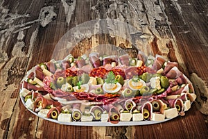 Plateful Of Traditional Serbian Appetizer Dish Meze Set On Old Weathered Cracked Flaky Garden Table Surface photo