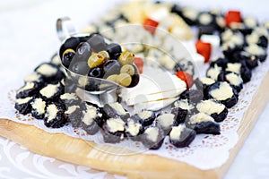 Plates with assorted finger food snacks on an event party or dinner