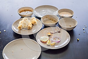 Plates with crumbs of food. Remains of food in plates after lunch or dinner