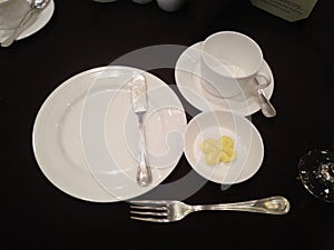 Plates and cups and knives and forks for meals