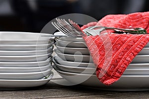 Plates, cutlery, & napkins on outdoor table