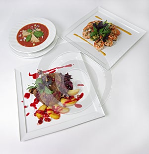 Plates of fine dining meal