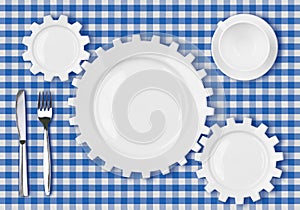 Plates gears work concept. Dinner dishes over tablecloth.