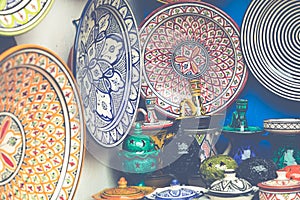 Plates, tajines and pots made of clay on the souk in Marocco.