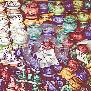 Plates, tajines and pots made of clay on the souk in Marocco.