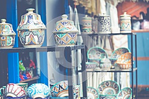 Plates, tajines and pots made of clay on the souk in Marocco.