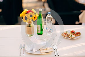 Plates at the wedding banquet. Table setting. Wedding decoration