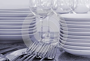 Plates, wineglasses, cutlery - toned image
