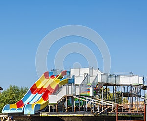 Platform with water children`s attractions roller coaster stands