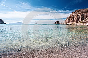 Plathiena beach with crystalline water on Milos island in Greece