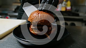 Plating Of The Gourmet Burger Inside A Kitchen