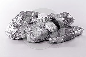 Platinum nugget on an isolated white background  is a chemical element used in the chemical industry as a catalyst for the